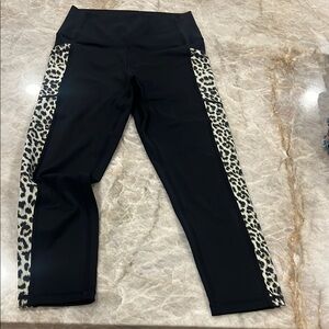 Zyia black leggings with leopard print down the sides 
Side pockets size 4